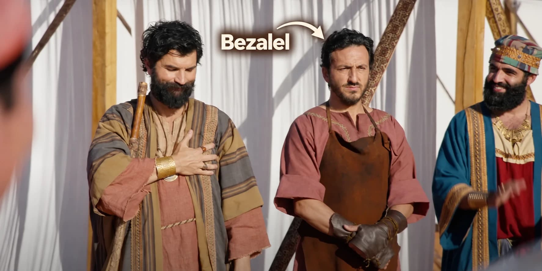 Annotated fan edit of an episode still, with a Bezalel label and arrow pointing to the central man in the leather apron.